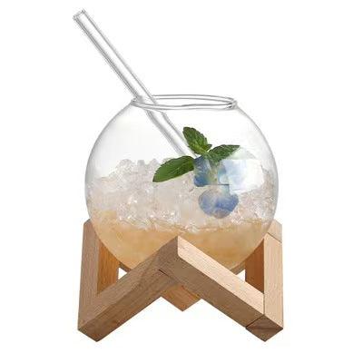 Modern double-wall glass with a spherical design, ideal for enjoying hot drinks safely.