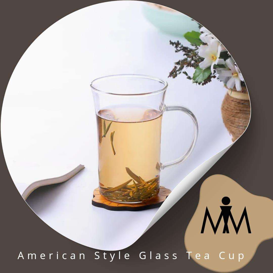 Elegant borosilicate glass cup, crystal-clear mug with sturdy handle.